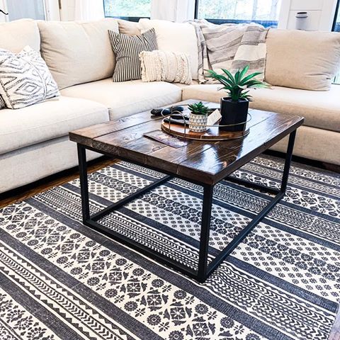 We love this 🛋! Perfect for watching movies on our 4K 📺 No detail overlooked!  Coffee table handmade by @timberandsteel.co .
.
.
@urbanfarmhousedesigns 
#diy #livingroomdecor #magnoliamarket #hgtv #housegoals #farmhousechic #mckinneytx #okc