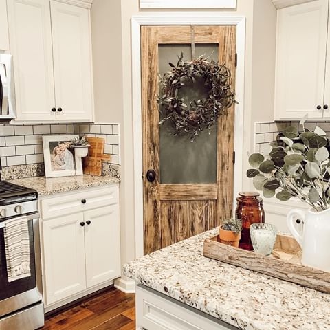 Who doesn't just lose it over a good pantry? 😌 Yes pantry goals is a whole movement now and couldn't help but fall in love with @olivebranchcottage pantry door! 😍⁣
⁣
⁣
⁣
The distressing in ole Sheila (yes she has a name so be kind! 😂) has us weak in the knees! We wonder what kind of goodies hide behind her. We hope to find out soon! 😉❣️⁣
⁣
⁣
TAG a friend who loves some good pantry inspo! 🤗⁣
⁣
⁣
⁣
FOLLOW US for more farmhouse inspiration! 👇⁣ 🌿 @decorsteals 🌿⁣
⁣
⁣
⁣
#butlerspantry #fixerupper #fixerupperstyle #pantry #fixerupperdecor #wreath #antiquedoor #stainlesssteel #groceries #woodfloors #kitchendecor #whitekitchen #kitchensofinstagram #kitchenessentials #kitchendesign #betterhomesandgardens #bhghome #subwaytile #ourblessednest #granitecountertops #cabinets⁣
⁣