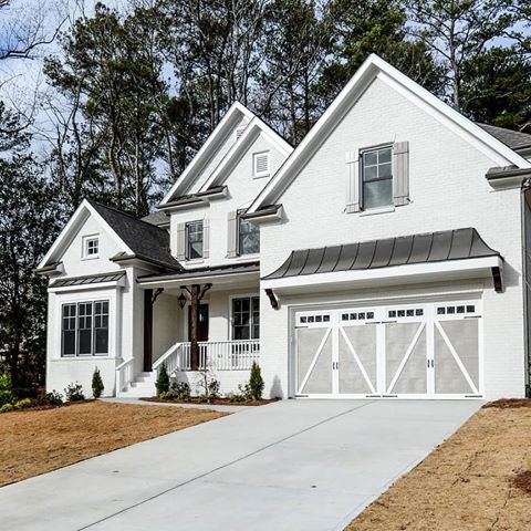 A white painted brick exterior gives this home major curb appeal. It's just as impressive on the inside too! Head to the photo gallery on our website to see more. Link in bio. #WaterfordHomes