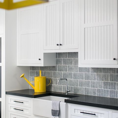 A mudroom made with sand + sunshine in mind ☀️ We enjoy more beach days than rainy days around here (not complaining) but it’s still essential to have a space to contain the mess that comes along with the coastline fun 🏖⁣⁣
⁣⁣
Speaking of sunshine... how happy are these bright yellow fixtures + accents?! 💛 The perfect pop to this clean + classic color scheme 🤗⁣
⁣
// #projectnewportwaterfront 📷 @ryangarvin⁣
Build: @pattersoncustomhomes 
Architecture: @sinclairassociates