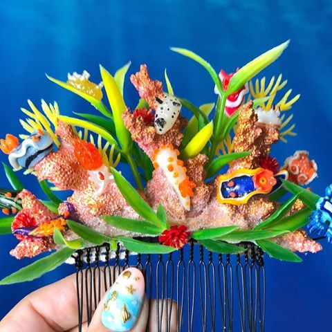 I’m pretty excited to share this with you guys! By pretty excited, I mean OVER THE MOON! I got contacted by a fellow nudibranch lover to make a wedding hair comb, colorful and bright for a wild jungle wedding in Australia! She wanted Nudibranchs from all over the world, and the only solid request was a Glaucus atlanticus. So after making a ton of sea slugs for the last two weeks, this comb came together! 
There are 12 little sea slugs total climbing-handmade faux coral (I don’t use any threatened material in my work!) in gold and pink golds, clustered with green and aquarium foliage, and some tiny red Coral polyps. The end result is one I don’t actually want to part with at all! It’s too amazing! 
I can’t wait to get photos of this in her hair! 
#reynoldsadvancedmaterials #miniatures #aquariumhobby #sealife #miniatures #polymerclay #bridalhair #bridalhairclip #haircomb #bridalcomb #bridalhairstyle #scubadiver #scuba #diver #diving #scubadiving  #scubadiver #scubawedding #beachwedding #beachtheme #oceanwedding #sealife #marinelife #seaslugs #seaslug #nudibranch #nudibranchs #mermaidhair #mermaidstyle #mermaidsofinstagram